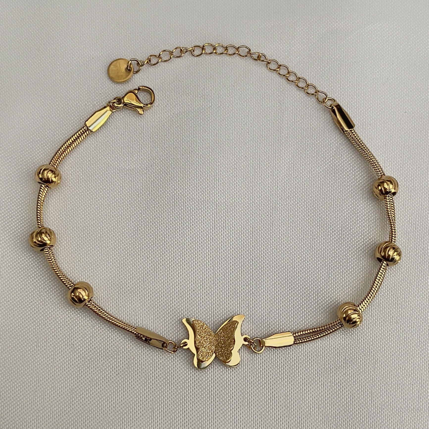 Vlinderarmband met balletjes